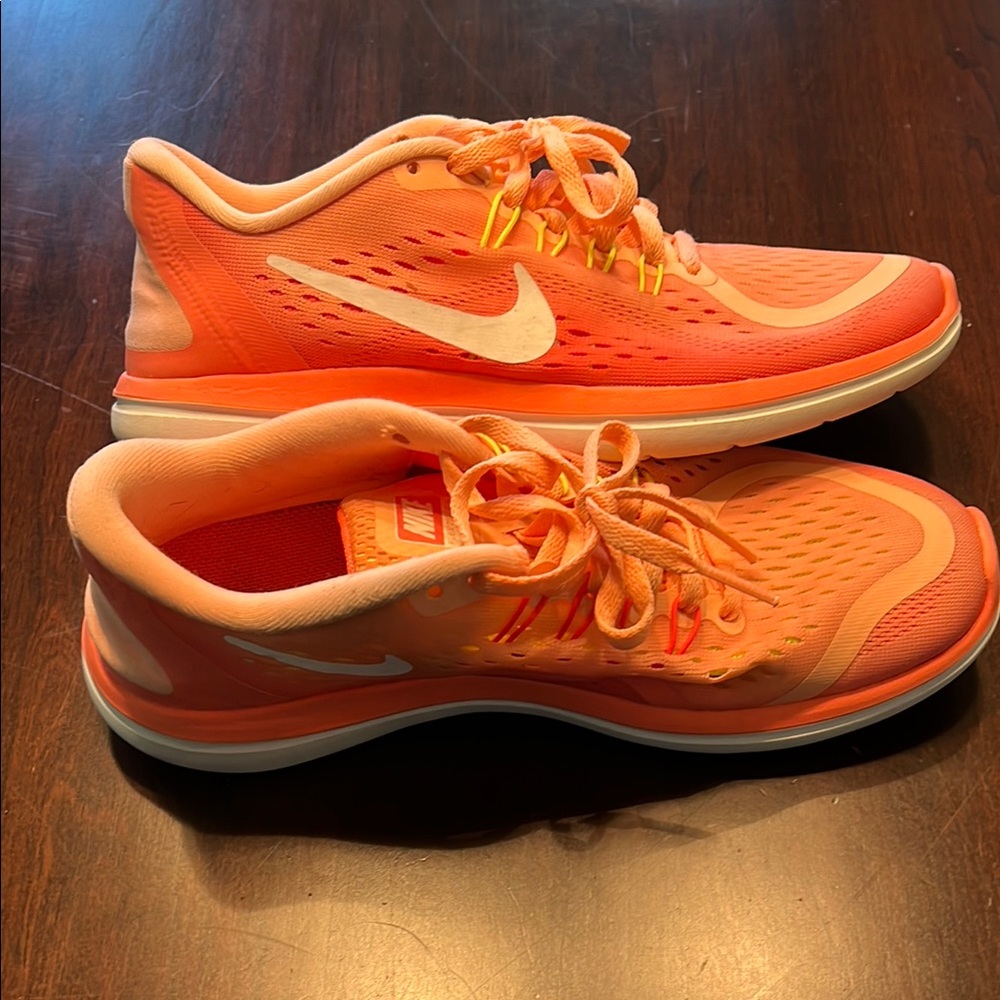 Nike Orange Athletic Shoes with Breathable Mesh and Flex Cushioning